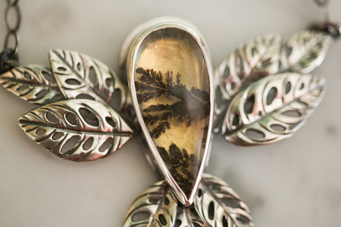 Golden Glow Monstera Adansonii Necklace